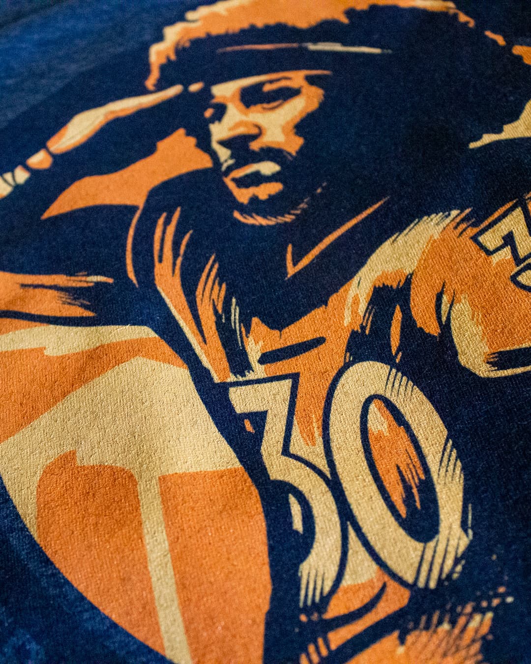 Example screen print of Broncos player Phillip Lindsay saluting